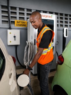 An employee connects a vehicle to a charger. Photo supplied by AVA.